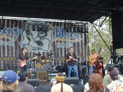 The Wildcats performing live on a stage